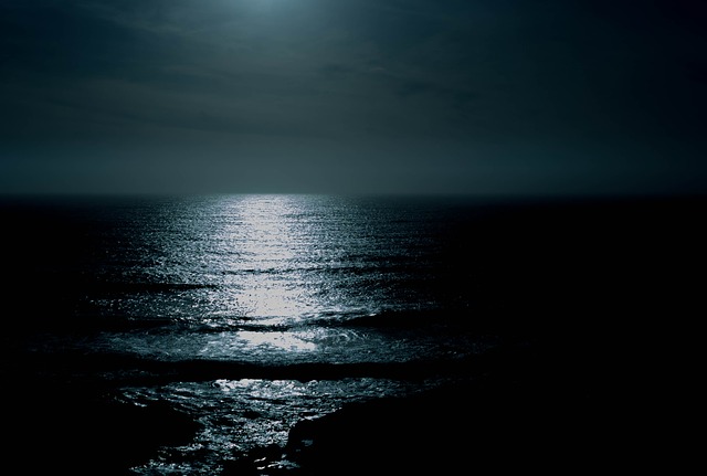 a moon over the ocean